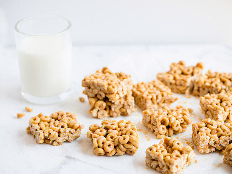 square cereal bars with a glass of milk