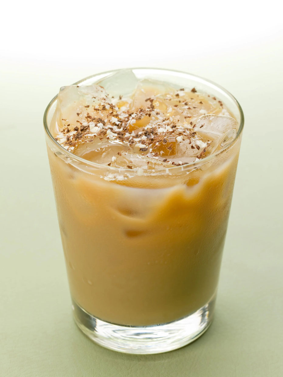 iced latte in a glass with chocolate shavings on top